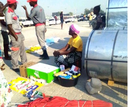 Security guards attempt to chase vendors off streets