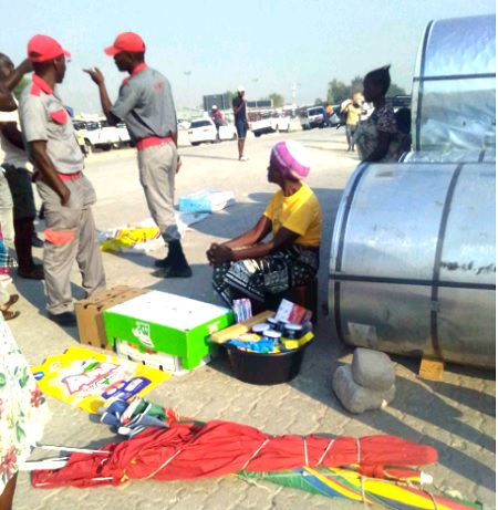 Security guards attempt to chase vendors off streets